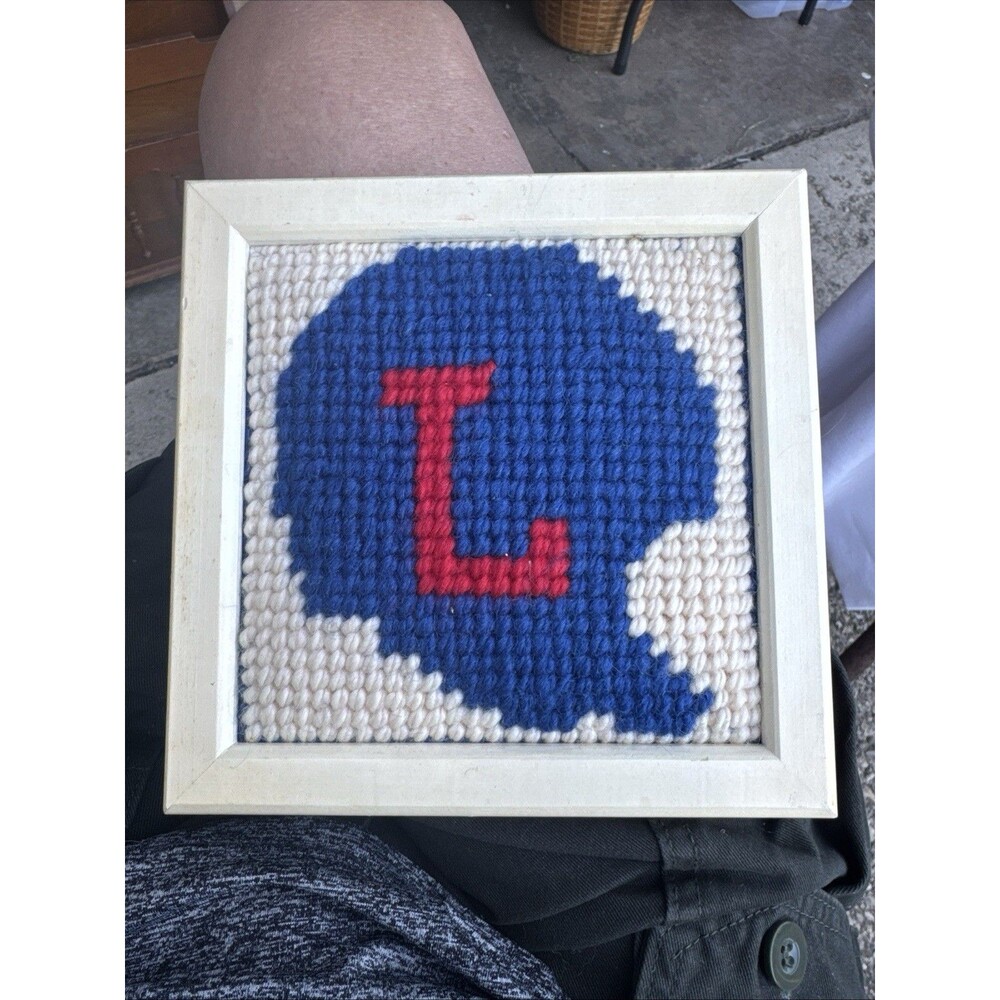 Vintage Needlepoint Stitch Blue Helmet with L logo Framed 7x7